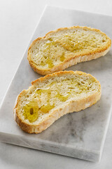 bruschetta with olive oil on a board
