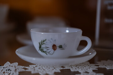Traditional turkish coffee cup on white lace