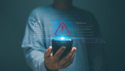 Man using smartphone with red triangle caution warning sign alert for notification error and maintenance, cyber security, Ransomware, Phishing, Spyware, hacker attacks and hacking data.