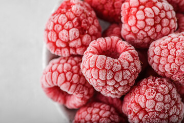 frozen raspberries in a grey bowl