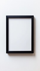 Close-up empty black frame on minimalist white background