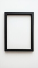 Close-up empty black frame on minimalist white background