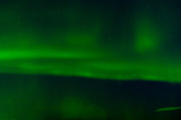 Amazing northern lights with starry sky. Aurora borealis in Reykjavik,  Iceland