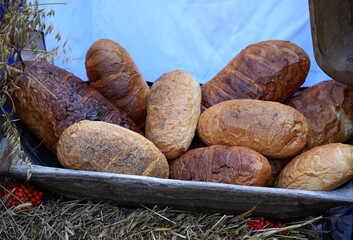 Many loaves of bread are stacked.