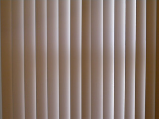 beige shades in front of window blocking light