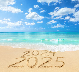 2024 and 2025 on a beach sand