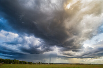 Storm clouds in the sky, rain on the horizon, summer season