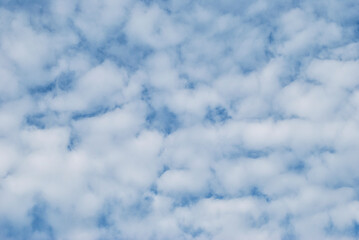 gentle white clouds in the blue sky