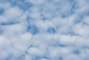 gentle white clouds in the blue sky