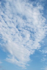 gentle white clouds in the blue sky