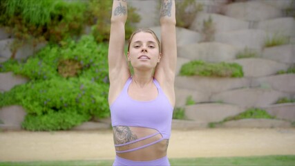 Strong and beautiful woman embraces the outdoors as she practices fitness and yoga, showcasing her remarkable athleticism and unwavering dedication to maintaining a healthy, balanced lifestyle