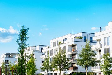 Fototapeta premium Contemporary residential buildings, community with lush greenery, modern architecture and well-maintained landscape, New apartment buildings