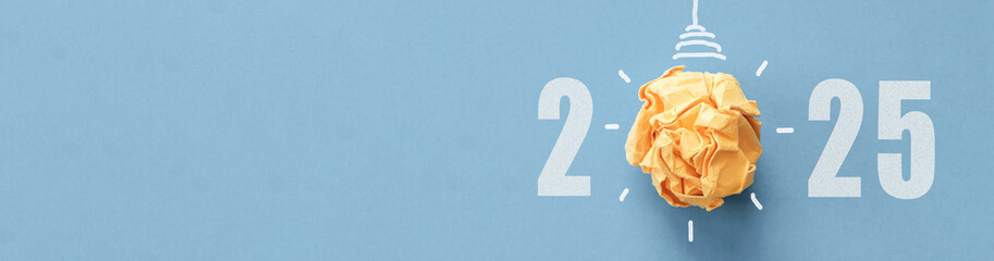 2025 with Yellow paper light bulb, innovative business vision and new year resolution concept