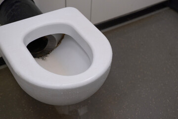toilet in public restroom, personal hygiene act, toiletpaper thrown into in toilet, clogged toilet...