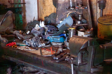 Vintage Mechanical Workshop with Visible Tools and Parts in Disarray