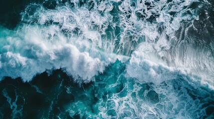 A breathtaking aerial shot capturing the dynamic movement of turbulent ocean waves, showcasing the powerful force of nature..