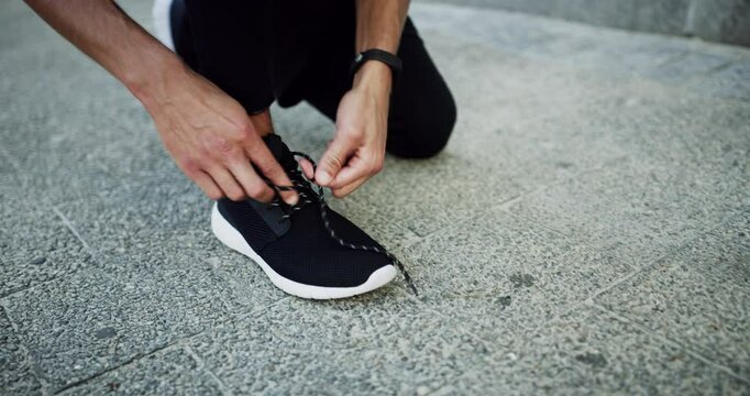 City, shoelace or man with exercise, closeup or sports with cardio workout, ready for running or performance. Activity, sneakers or outdoor with person, athlete or runner with training or tying laces