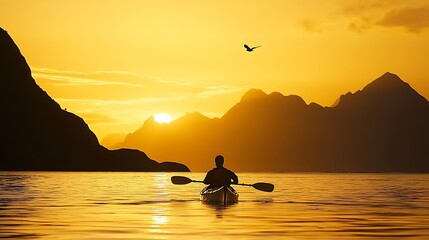 Serene Sunrise Kayaking Adventure - Silhouette of Kayaker in Black Against Golden Light with Mountain Backdrop and Flying Bird