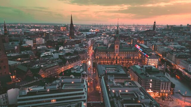 Hamburg night skyline aerial view, Drone footage of Hamburg city Germany, Group of people and tourist having walk on main square in Hamburg Rathouse. Townhall building.