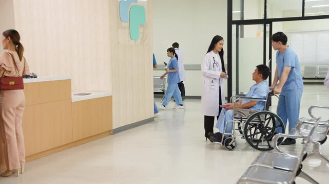 4K Specialized doctor medical center and hospital health care services concept. Hospital lobby waiting area in hospital with doctor and patient walking through corridor hallway and information counter