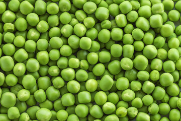 Fresh green peas as background, top view