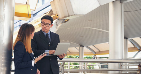 Business Partner using digital tablet online meeting team Partnership businessman, businesswoman talking together. Diversity Asian Business Partner online meeting trust teamwork. Asian Business team