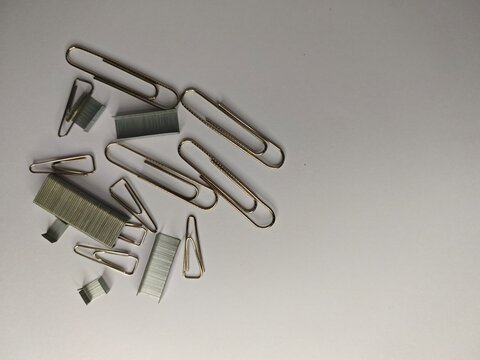 a scatters of clips and stepler on white background