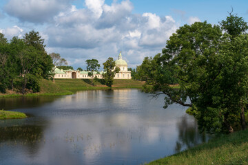 Fototapeta premium The Great (Menshikov) Palace from the side of the Lower Pond in the Oranienbaum Palace and Park Ensemble on a sunny summer day, Lomonosov, St. Petersburg, Russia