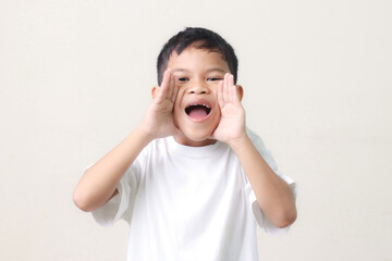 happy little boy isolated on white background.