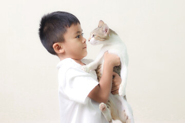 Relationship cat and human. Friendship with pet. Kid hug with gray cat on white background. Emotional support animal.