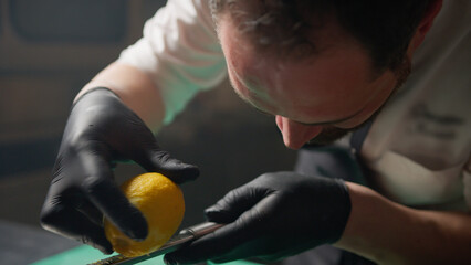 Chef Grating A Lemon For Acid Touch On A Dish