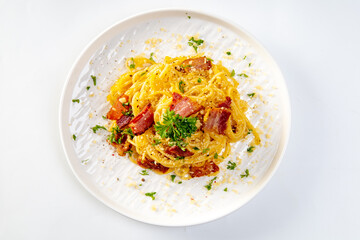 Spaghetti Carbonara in white plate on white background