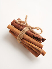 a stack of cinnamon sticks tight with a rope