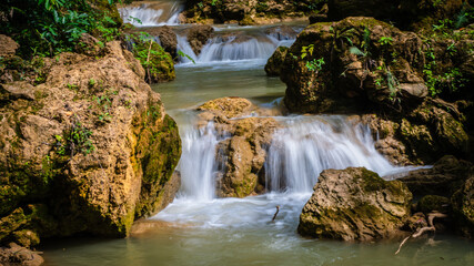 Fototapeta premium Huai Mae Khamin Waterfall, a beautiful waterfall with Seven floors are in Srinakarin Dam National Park, Kanchanaburi, Thailand.