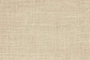 Closeup detail of beige fabric texture background. High resolution photo.