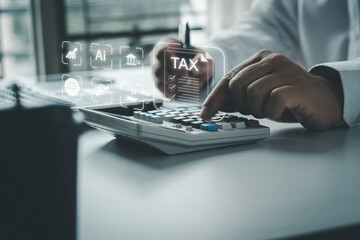 Businessmen using online personal income taxes payment calculators, and laptop computers to fill...