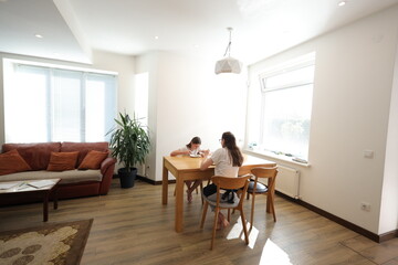 Mother and daughter eating at home
