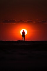 A silhouette of a person against a sunset, symbolizing the struggle with fatigue, sleepiness, and seasonal affective disorder syndrome. 