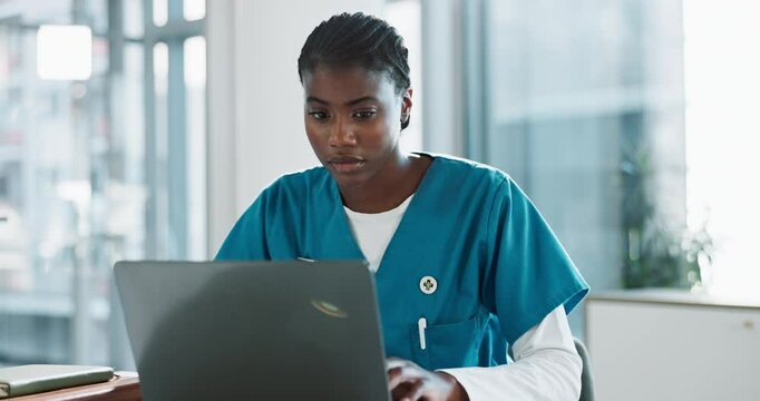Black woman, nurse and typing with laptop in medical research, study or discovery at office desk. Young African, female person or healthcare employee working on computer for online browsing at clinic