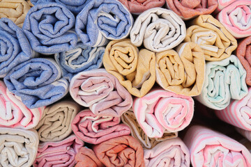 Discover a wide array of Colorful Rolled Fabrics featuring Various Textures and Unique Patterns