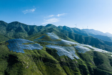 Obraz premium view of solar power station on green hill