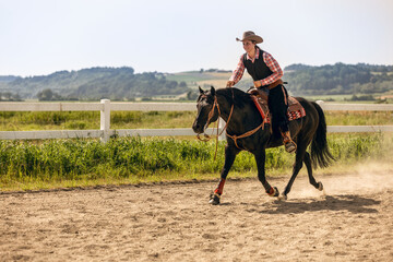 Western riding concept: A young woman and her black quarter horse stallion doing some reining...