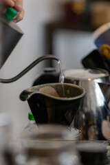 Drip coffee is a brewing method where hot water is poured over ground coffee, allowing it to drip slowly through a filter into a vessel below. The process extracts the coffee's flavor