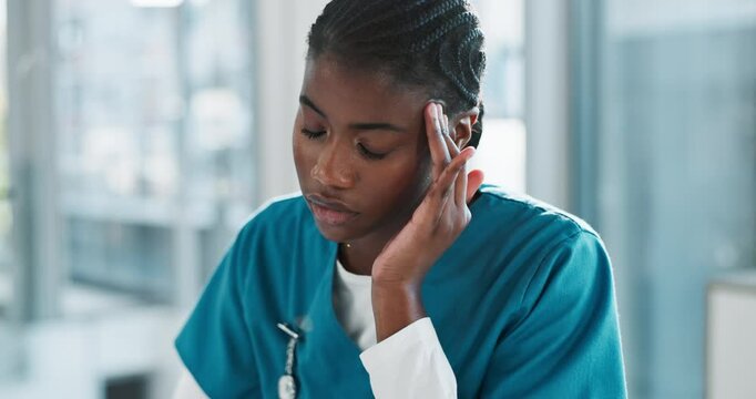 Black woman, nurse and stress with headache on laptop, pressure and overworked with anxiety at hospital. Tired, female person or medical employee with migraine in burnout, pain and strain at clinic