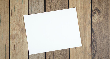 blank paper on wooden background