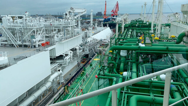LNG ship in the terminal unloading of natural liquefied gas. Energy supply