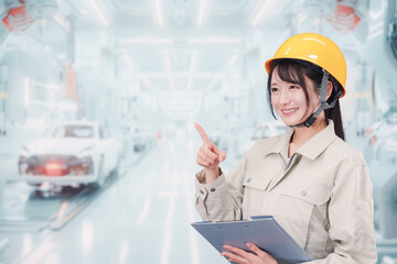 自動車工場の生産ラインで働く若い女性