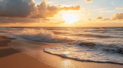 A serene beach at sunset, with the golden rays casting a warm glow on the sand and gently crashing waves