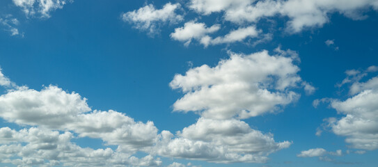 Blue sky cloud gradient background. Cloudy sky. Vivid cyan blue landscape in environment day horizon skyline view. White clouds on soft sky background. White cloudy sky.