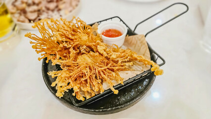 Crispy Deep Fried Enoki Mushrooms with Spicy Sauce. Golden needle mushroom with spicy dipping sauce.